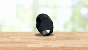 Loose Black Diamond Gemstone on Table